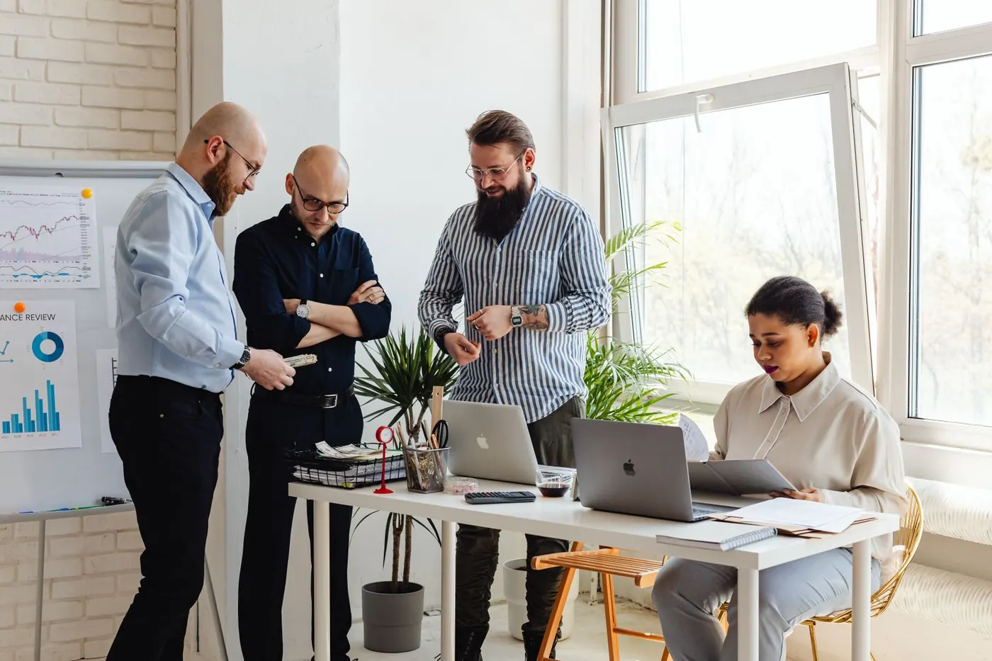 Colleagues working together in a bright office