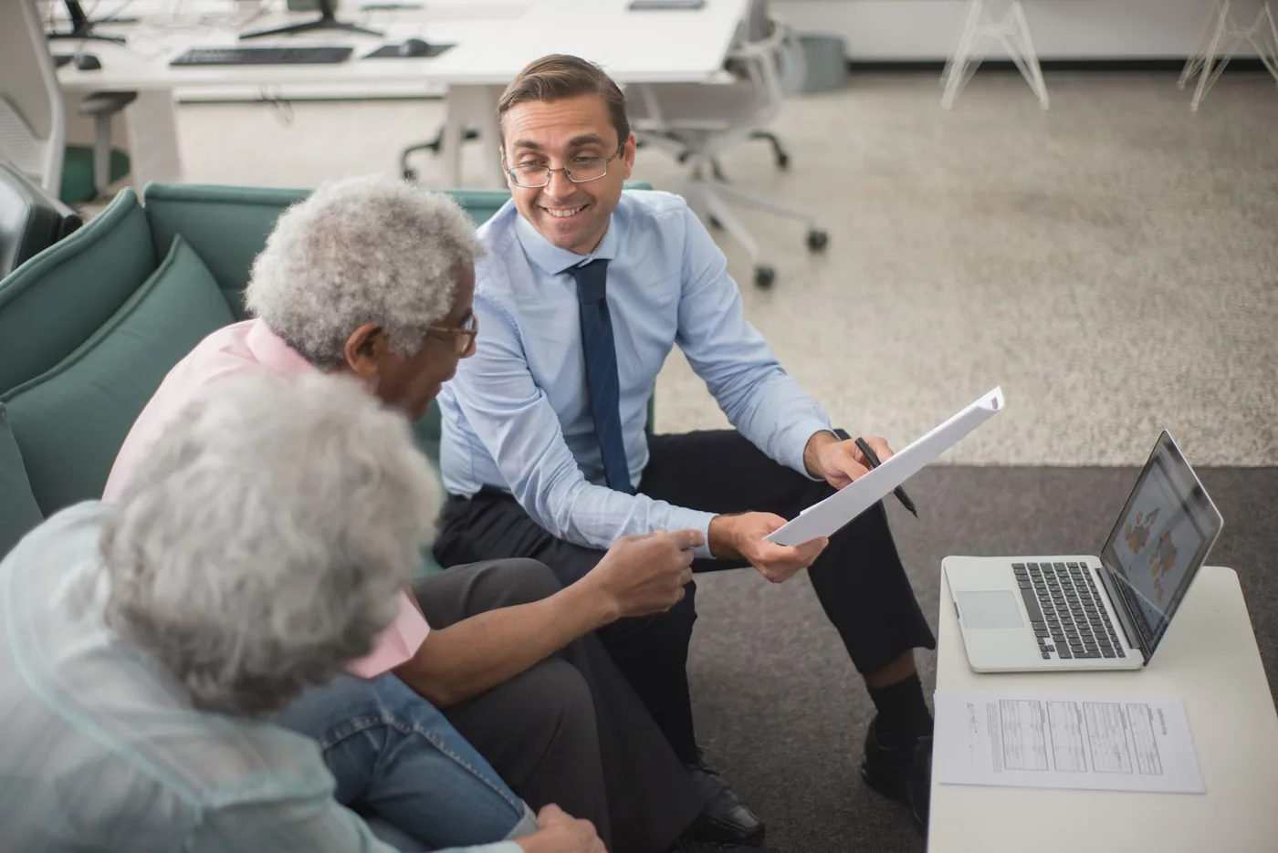A consultant going through a financial plan with senior clients